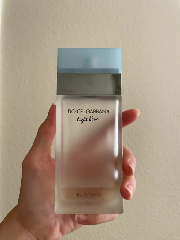 hand hoding Dolce & Gabbana Light Blue Perfume